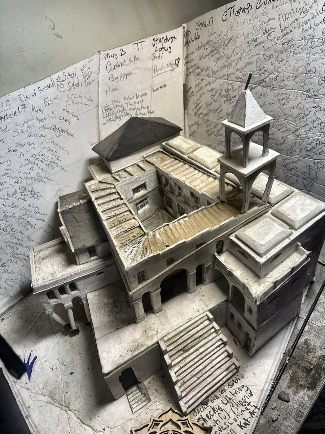 Photograph of a hand-built cardboard model of an impossible stair city
